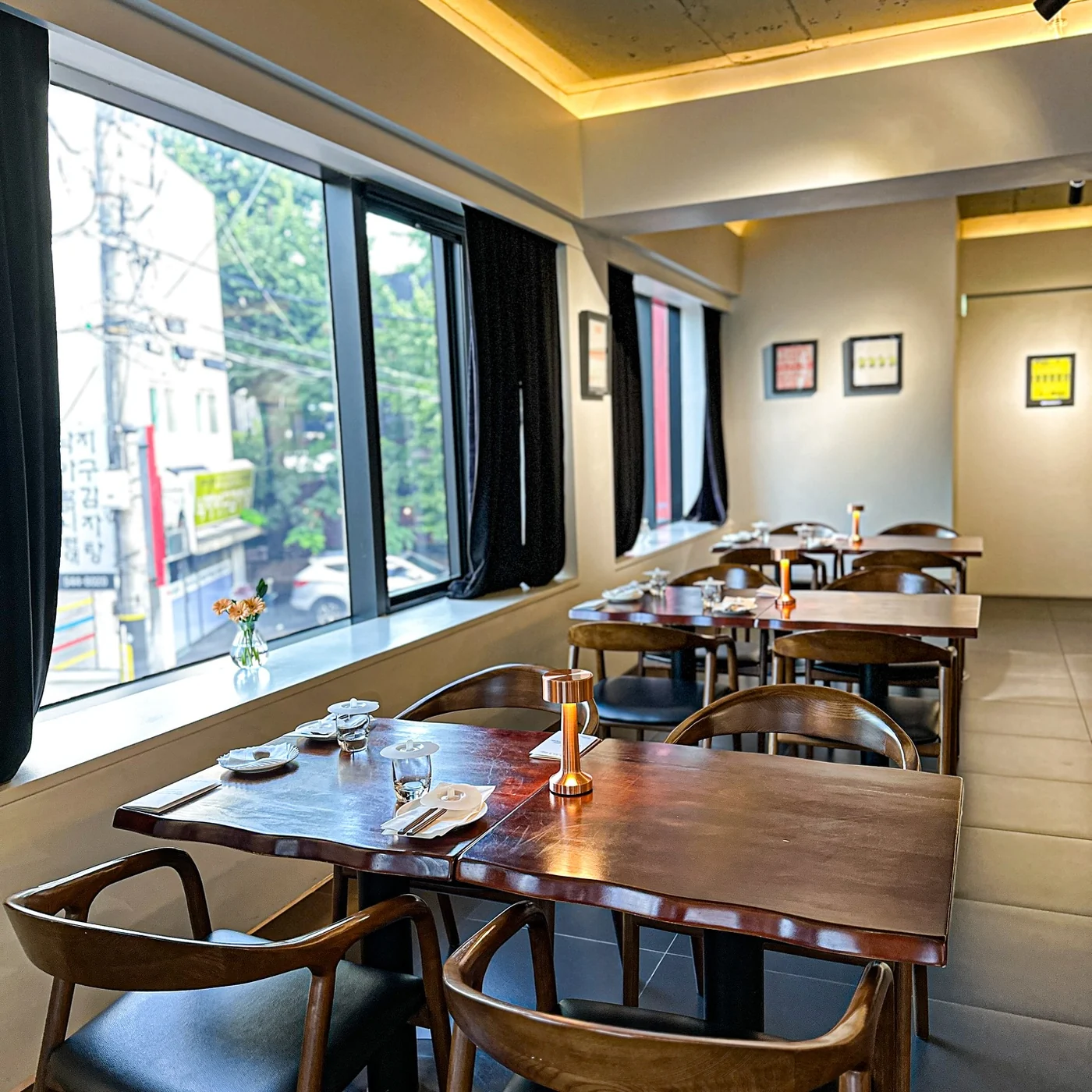Interior of Mahina Vegan Table with tables arranged along the windows