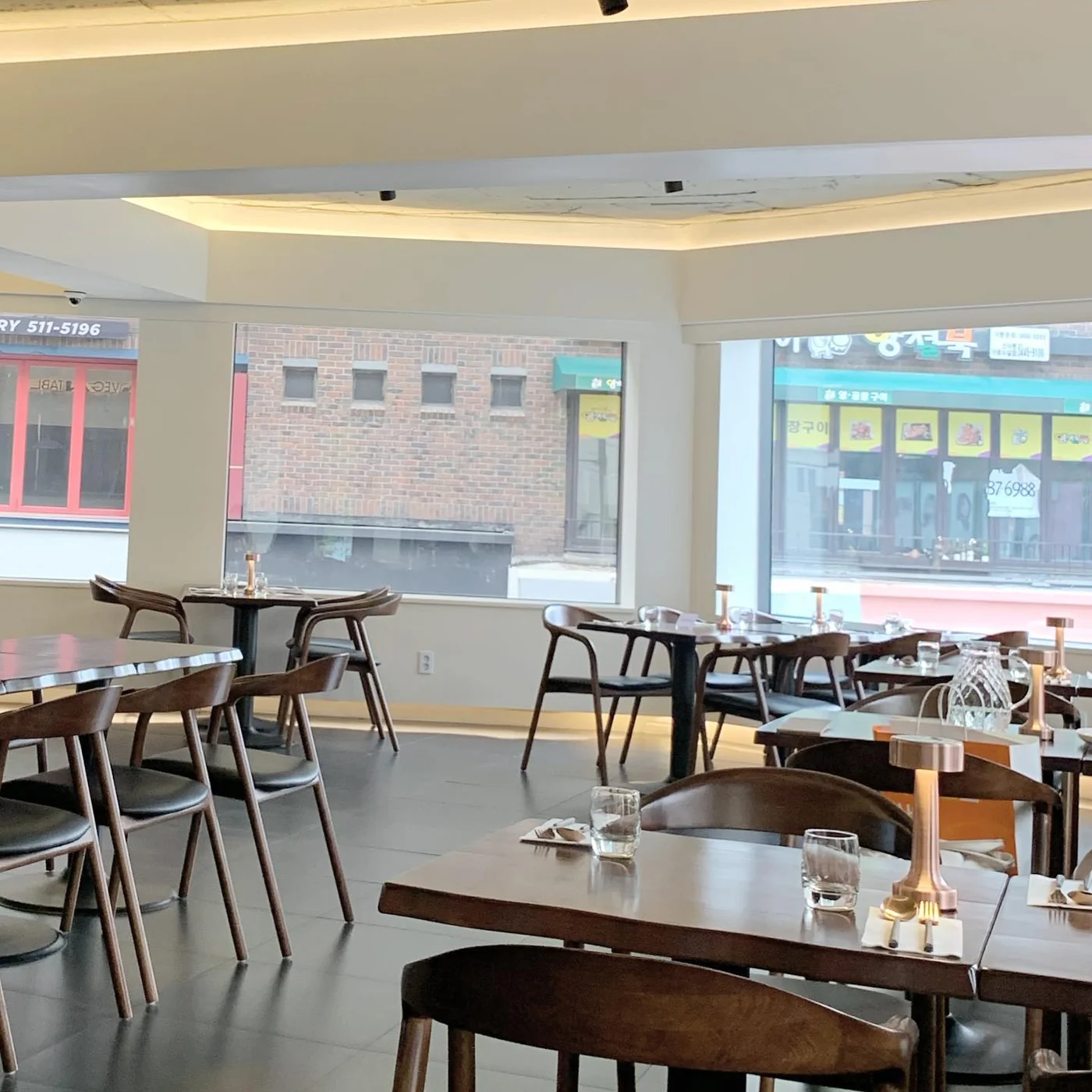 The interior of Mahina Vegan Table with wooden tables and chairs