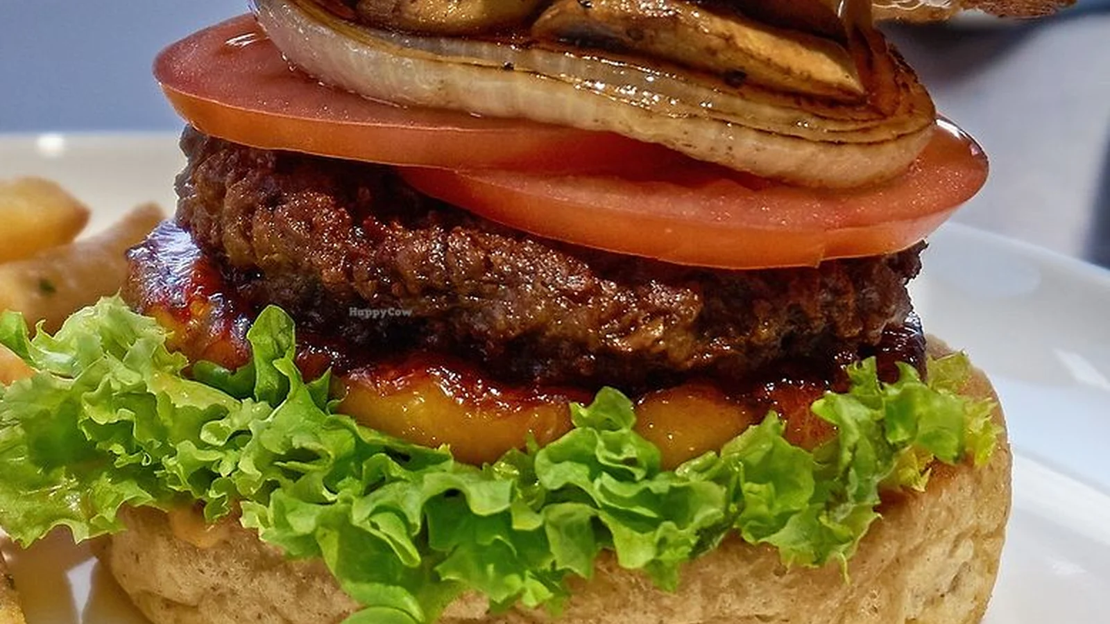 Mahina Vegan Table burger with grilled pineapple and a vegan patty