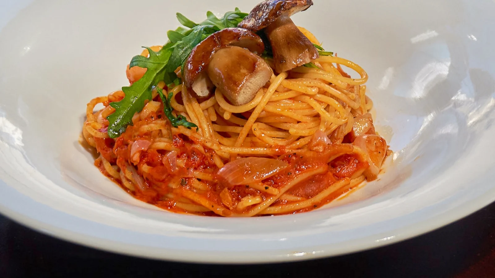 Mahina Vegan Table tomato pasta topped with grilled porcini and rocket