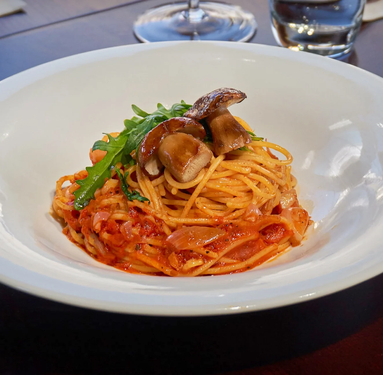 Mahina Vegan Table tomato pasta topped with grilled porcini and rocket