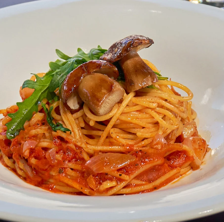 Grilled porcini over spaghetti in tomato sauce