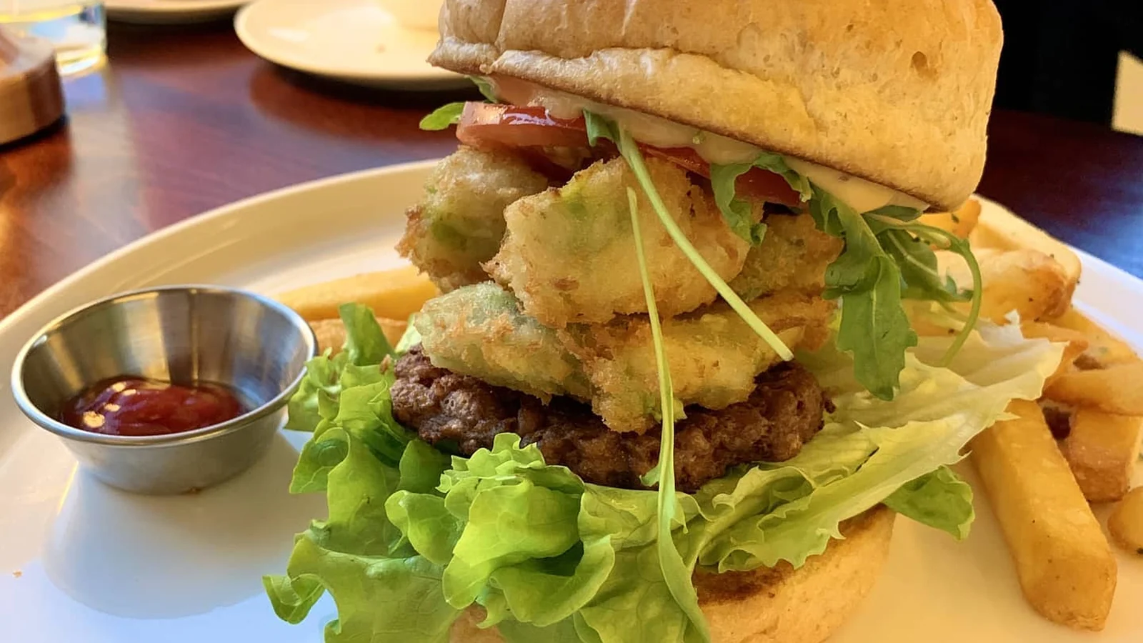 Mahina Vegan Table burger with fried avocado and a vegan patty