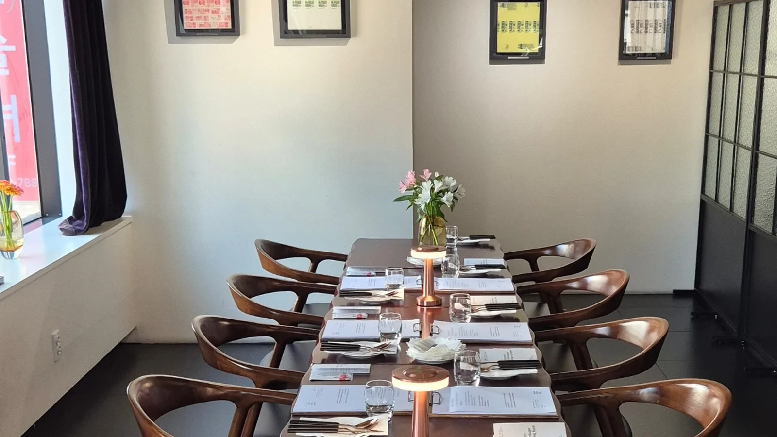 A long table set at Mahina Vegan Table for a group reservation