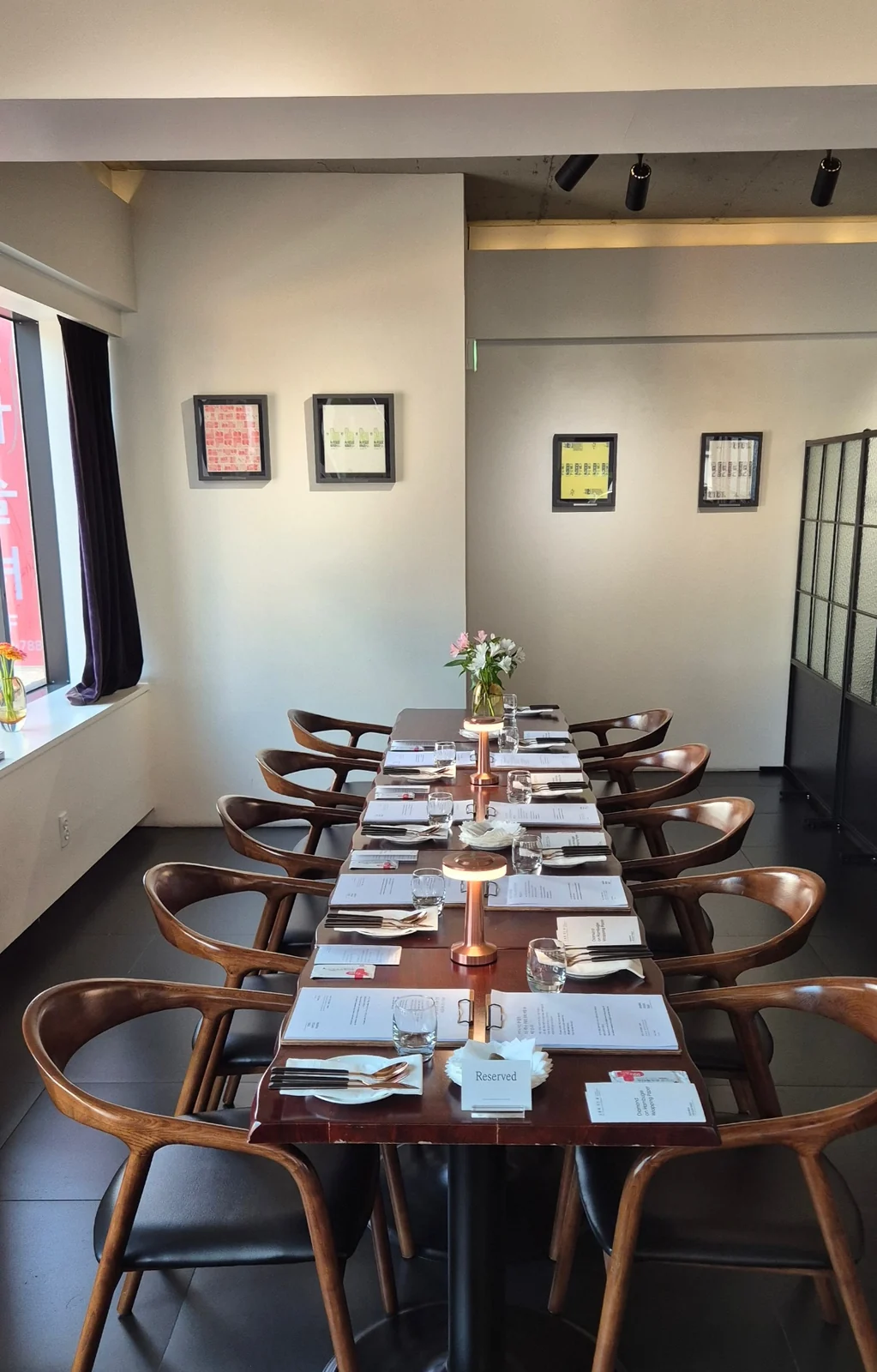 A long table set at Mahina Vegan Table for a group reservation