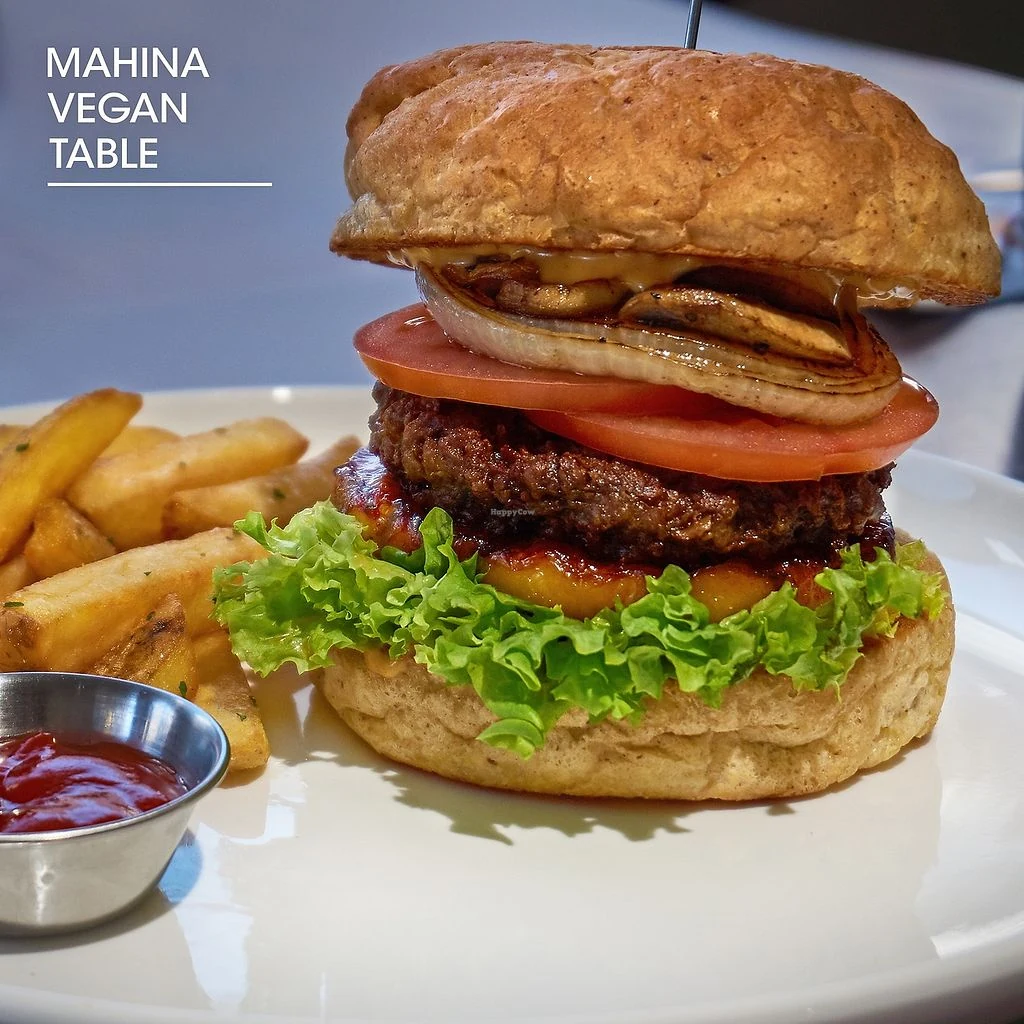 Mahina Vegan Table Grilled Pineapple Burger served with French fries