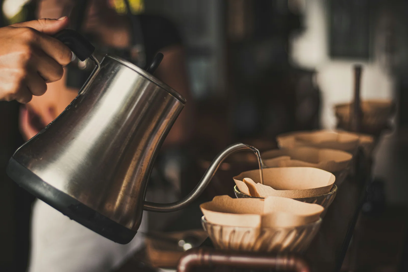 Preparing a pour-over at a coffee farm in Captain Cook, South Kona