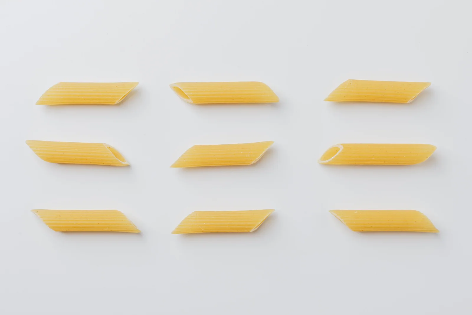 Penne rigate with diagonally cut ends and ridged surfaces