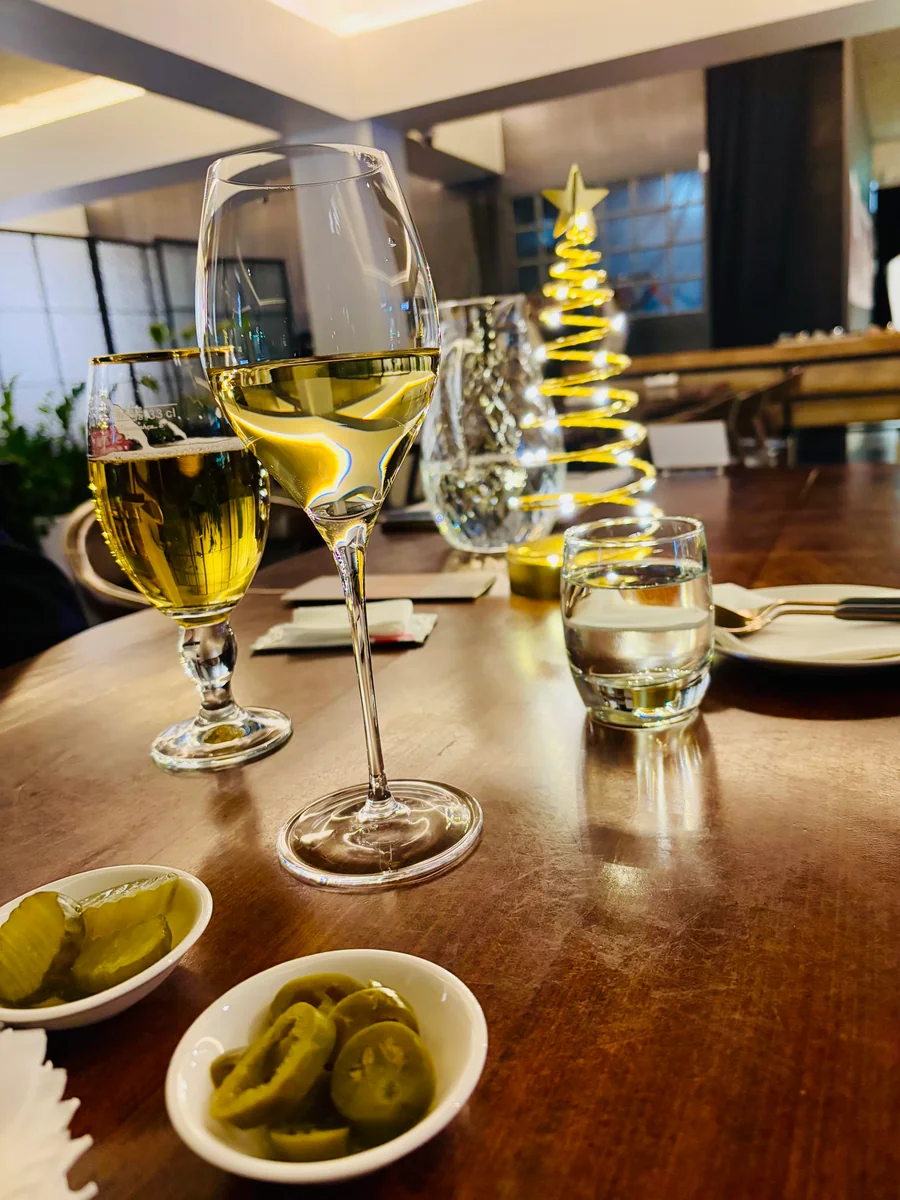 A table set with glasses at Mahina Vegan Table