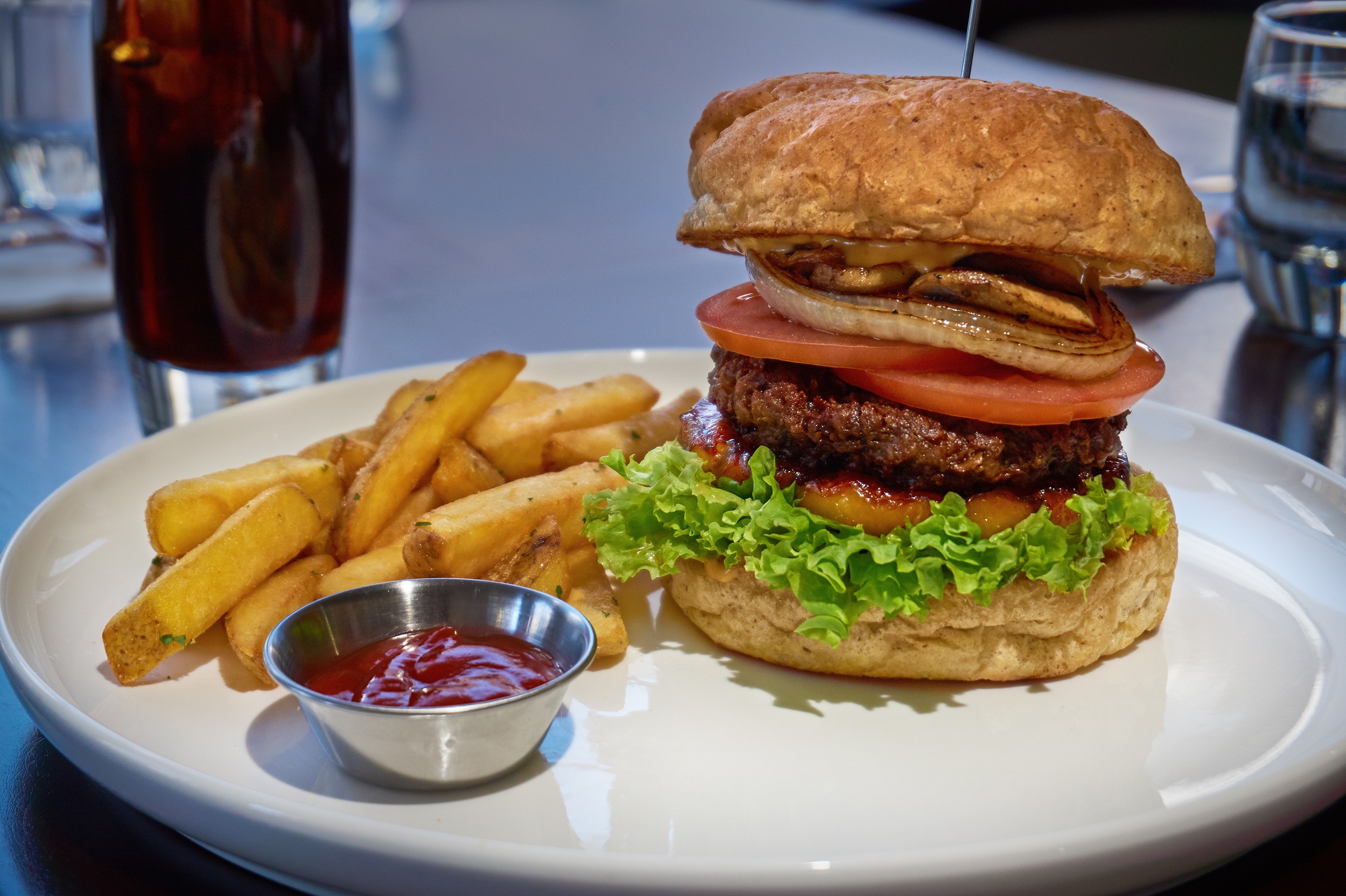 Grilled Pineapple Burger with grilled onions and button mushrooms