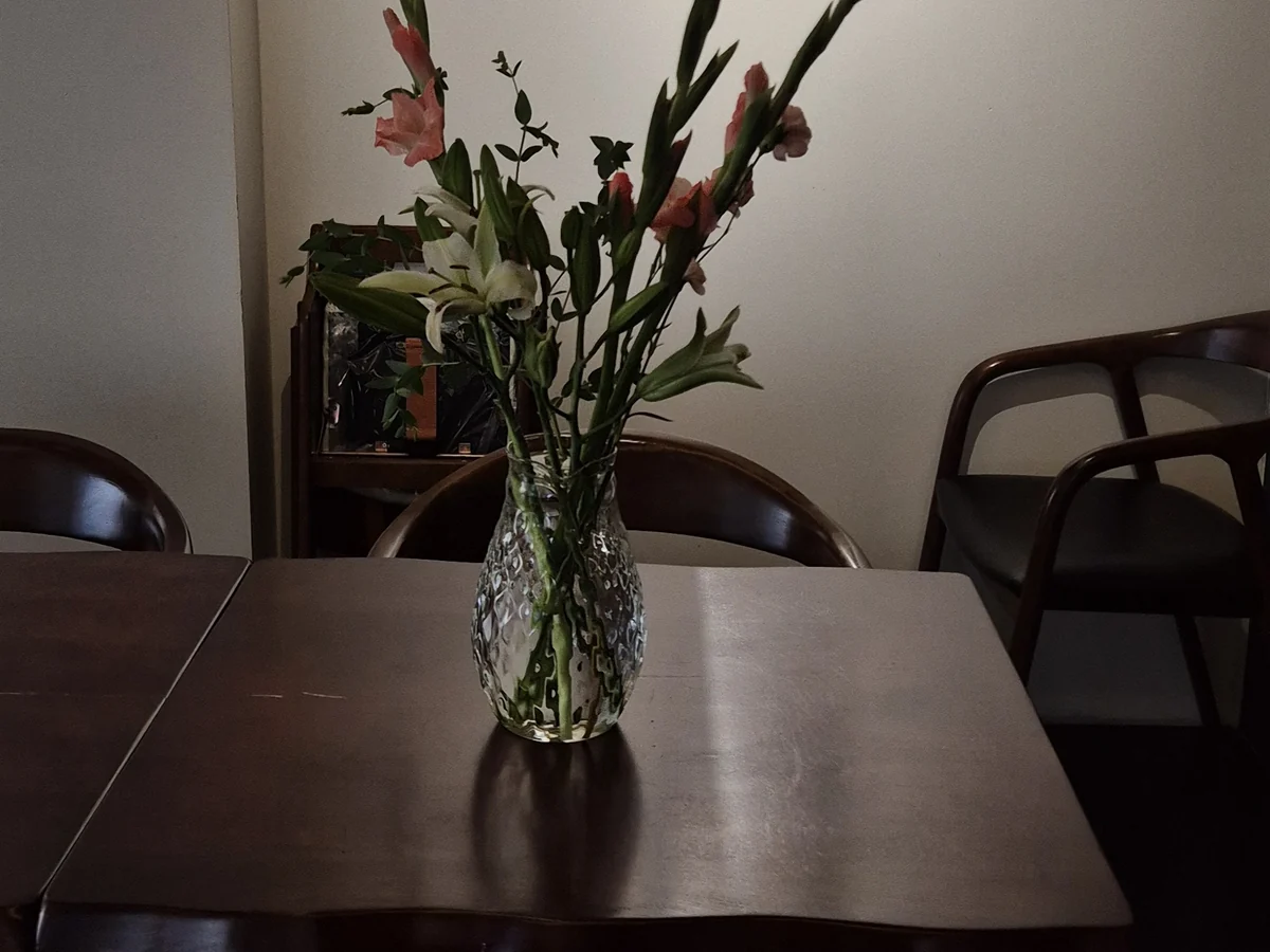 A quiet table with flowers inside Mahina Vegan Table