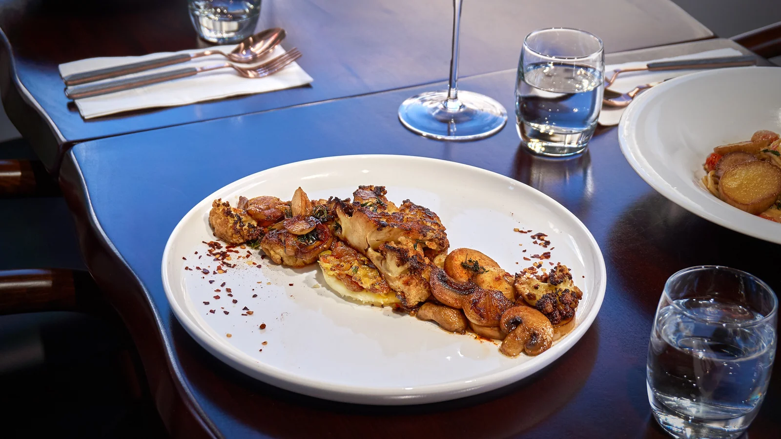 A mushroom and roasted vegetable dish served at Mahina Vegan Table